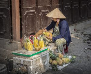Vietnamese Women Carving Pineapple