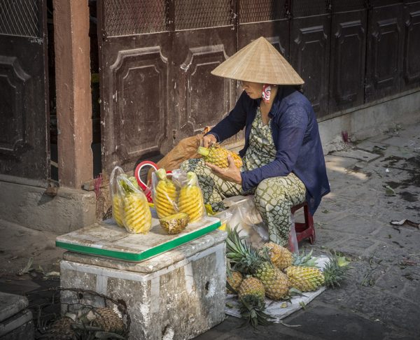 Vietnamese Women Carving Pineapple
